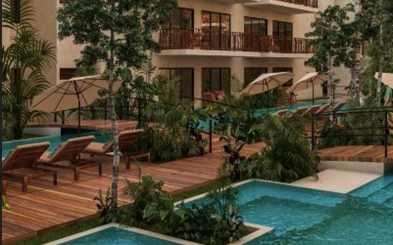 Green view condo with 32 m2 private garden, direct access to the pool from your terrace (swim up), gym, zen or yoga area, business center, Aldea Zama Neighborhood, Tulum for sale.