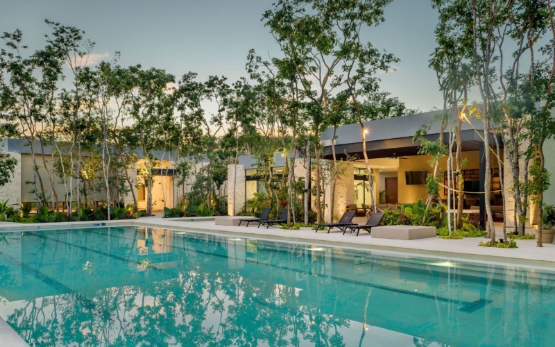 Land in a private residential community with a clubhouse, sports courts, swimming pool, and dog areas for sale in Playa del Carmen.