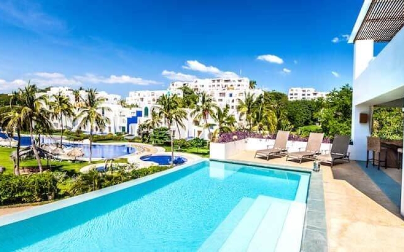 Oceanfront house with pool, beach club, Tangolunda Huatulco, for sale.