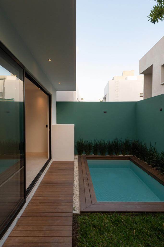 Luxury house with private pool, Green views, clubhouse with sports fields, in gated community Aqua, Cancun, for sale.