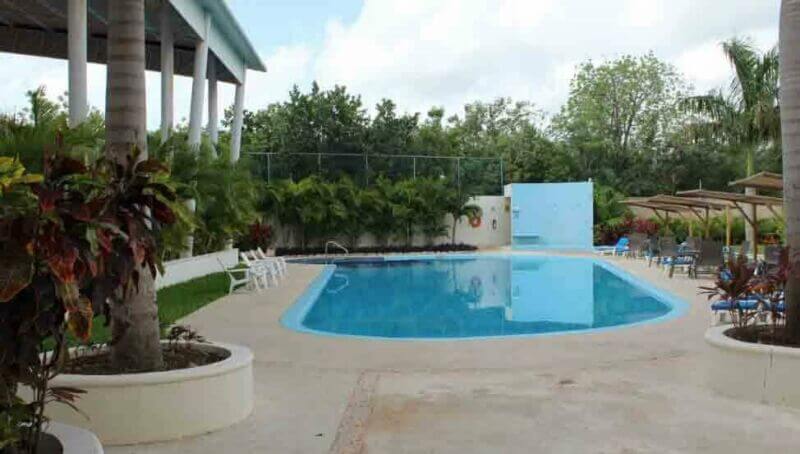 Luxury house with private pool, Green views, clubhouse with sports fields, in gated community Aqua, Cancun, for sale.