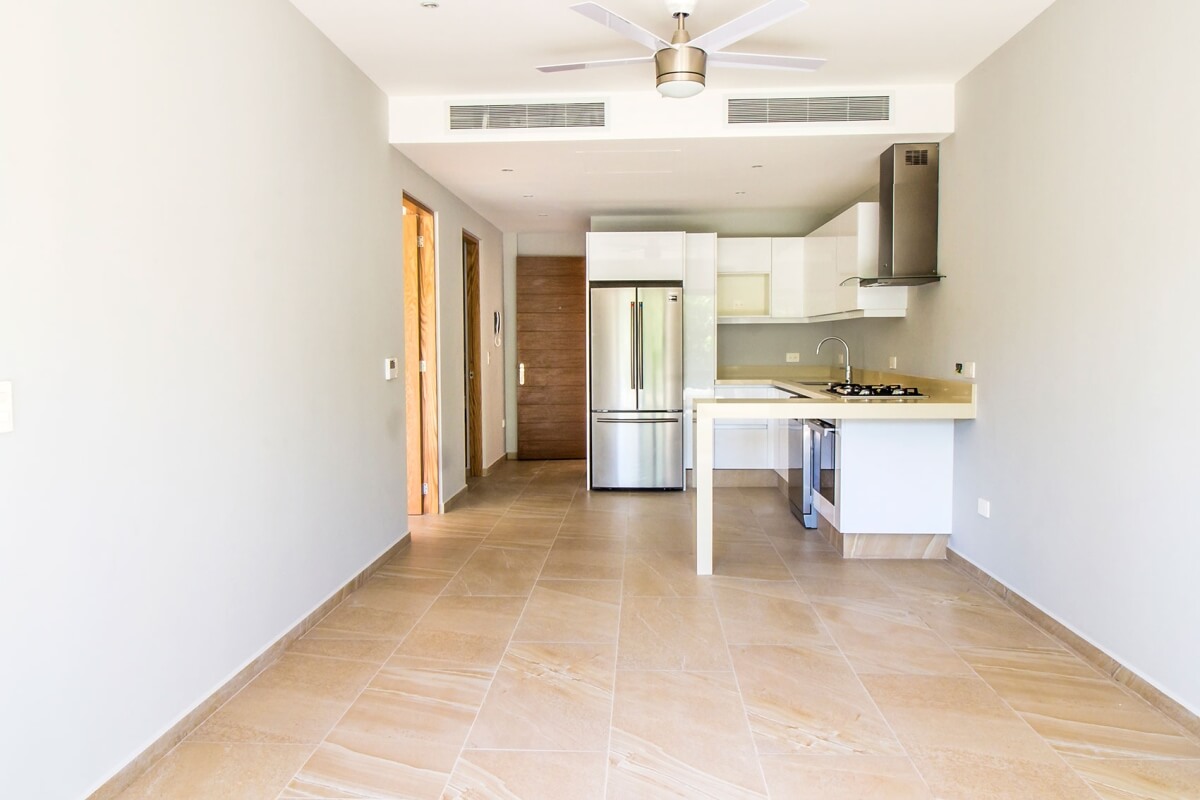 Ground floor condo with small garden, terrace with pool, jacuzzi, gym, coworking, concierge, pre-construction, for sale, Playa del Carmen.