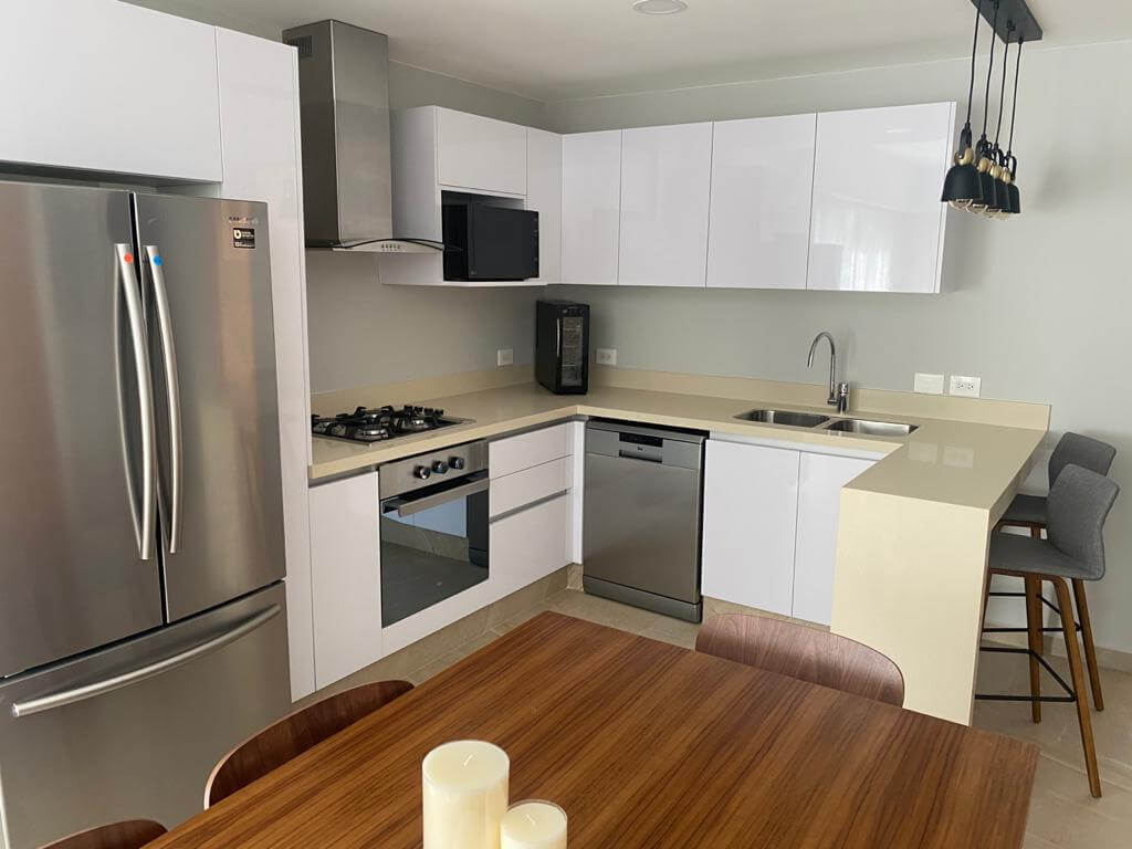 Ground floor condo with small garden, terrace with pool, jacuzzi, gym, coworking, concierge, pre-construction, for sale, Playa del Carmen.