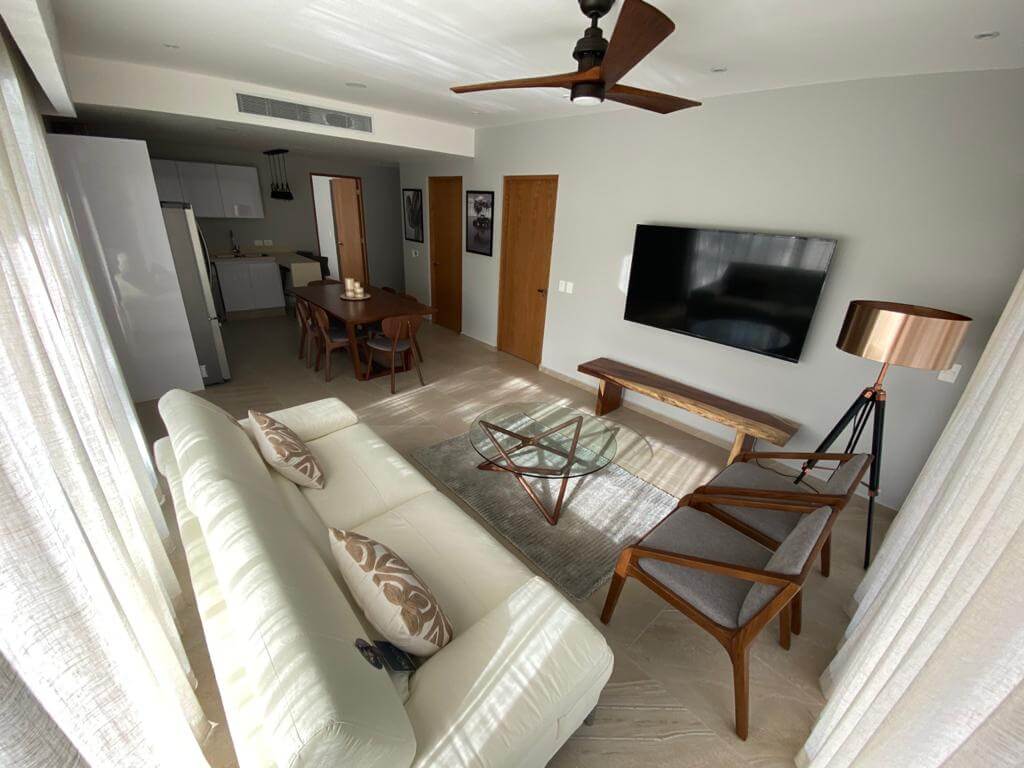 Ground floor condo with small garden, terrace with pool, jacuzzi, gym, coworking, concierge, pre-construction, for sale, Playa del Carmen.