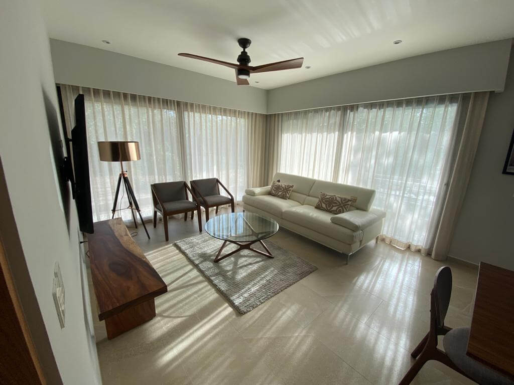 Ground floor condo with small garden, terrace with pool, jacuzzi, gym, coworking, concierge, pre-construction, for sale, Playa del Carmen.