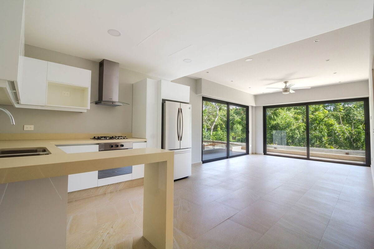 Ground floor condo with small garden, terrace with pool, jacuzzi, gym, coworking, concierge, pre-construction, for sale, Playa del Carmen.