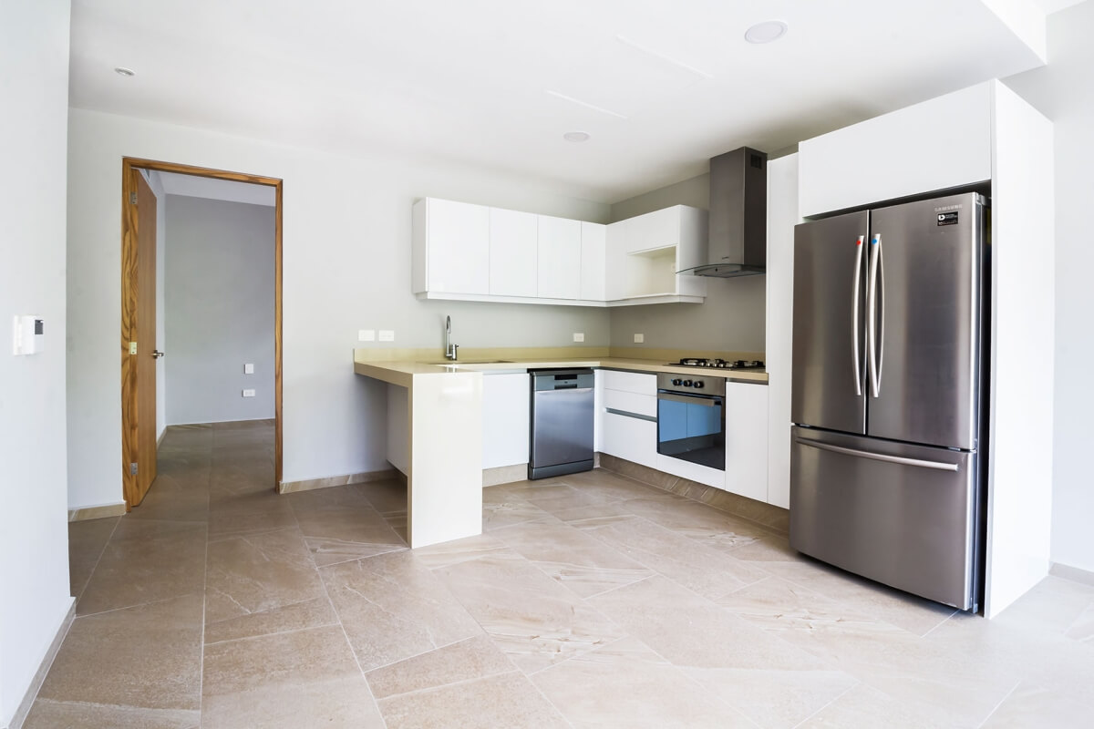 Ground floor condo with small garden, terrace with pool, jacuzzi, gym, coworking, concierge, pre-construction, for sale, Playa del Carmen.