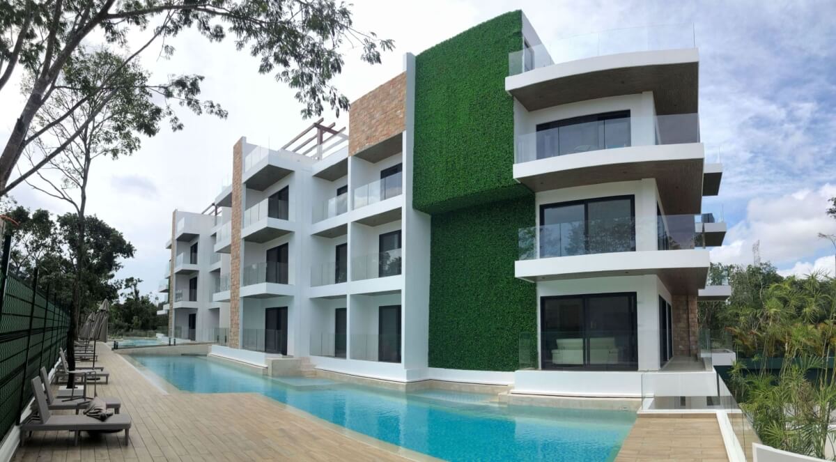 Ground floor condo with small garden, terrace with pool, jacuzzi, gym, coworking, concierge, pre-construction, for sale, Playa del Carmen.