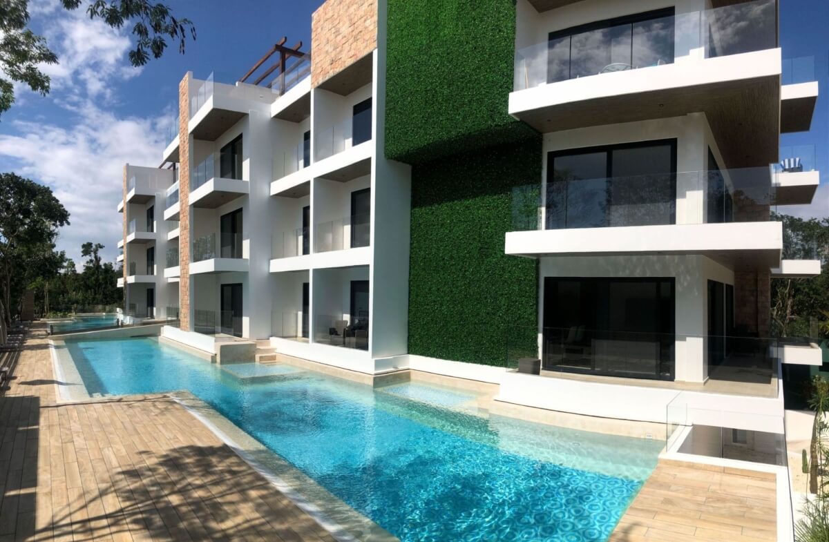 Ground floor condo with small garden, terrace with pool, jacuzzi, gym, coworking, concierge, pre-construction, for sale, Playa del Carmen.