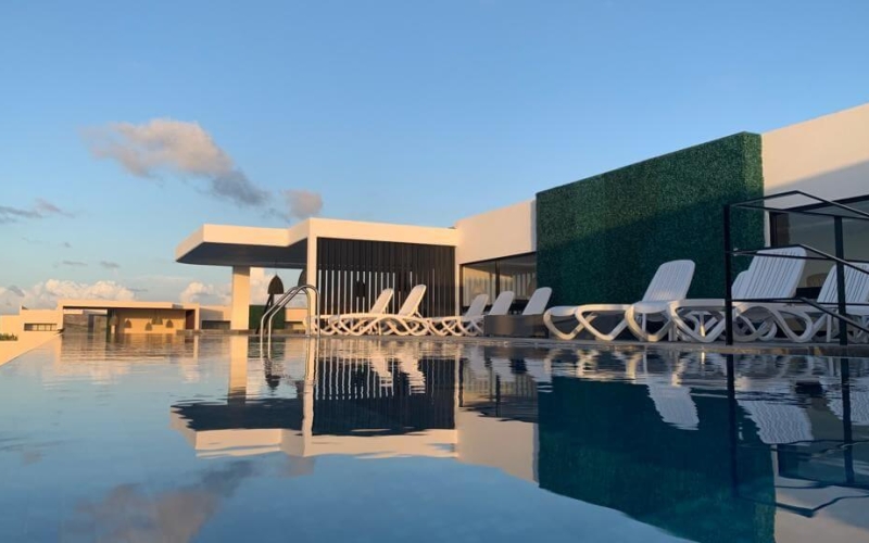 Turn key, furnished condo, REDUCED PRICE pool bar, infinity pool, gym with panoramic view, beach club access, for sale Aldea Zama Tulum.