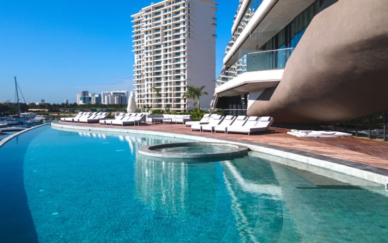 Ocean view condo with amenities: infinity pool, spa, gym, lounge area, event room, lobby, located in Puerto Cancun