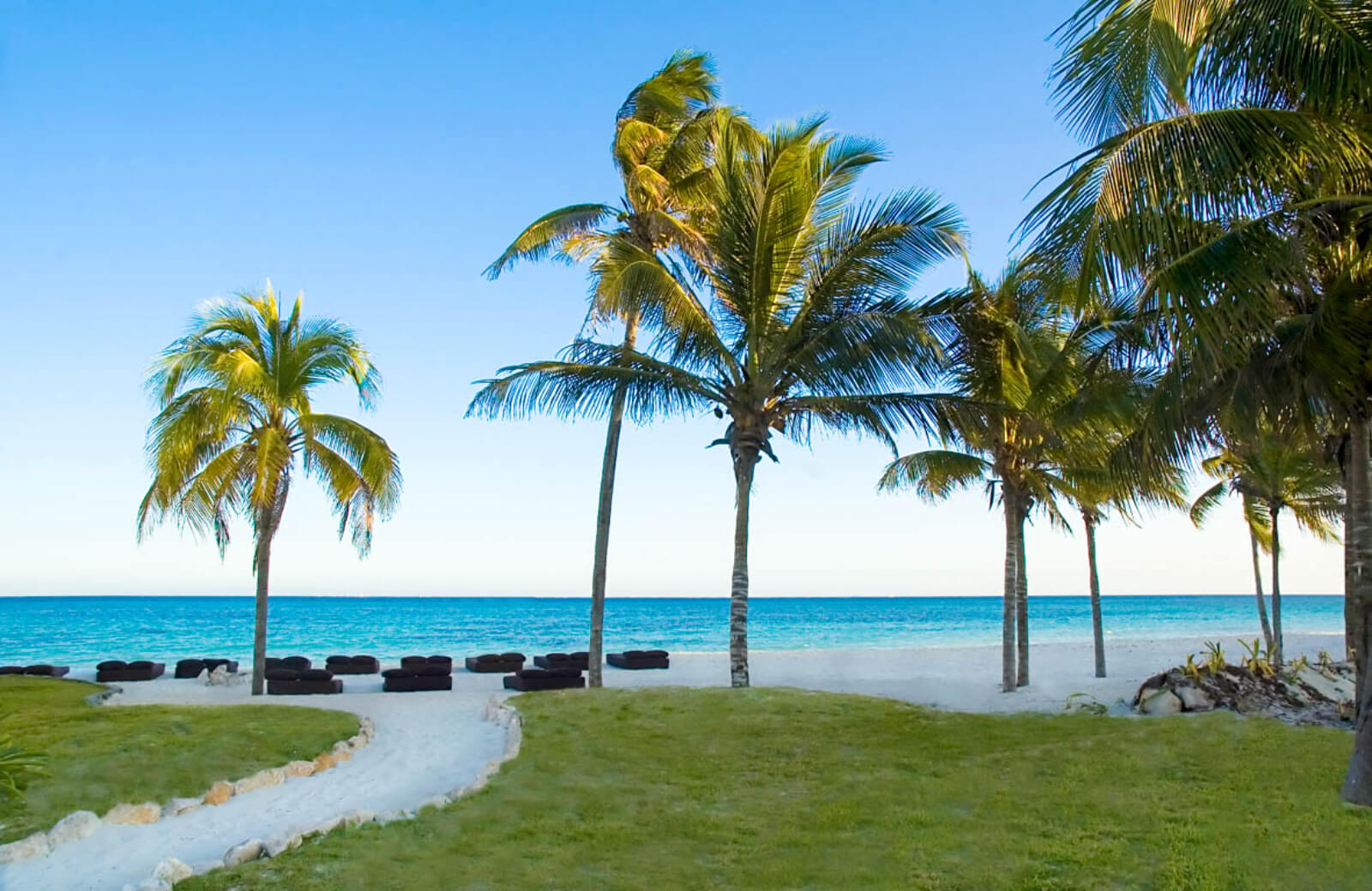 Beachfront condo with private pool, golf course, beach club, relaxing areas with hammocks, Corasol, for sale Playa del Carmen.