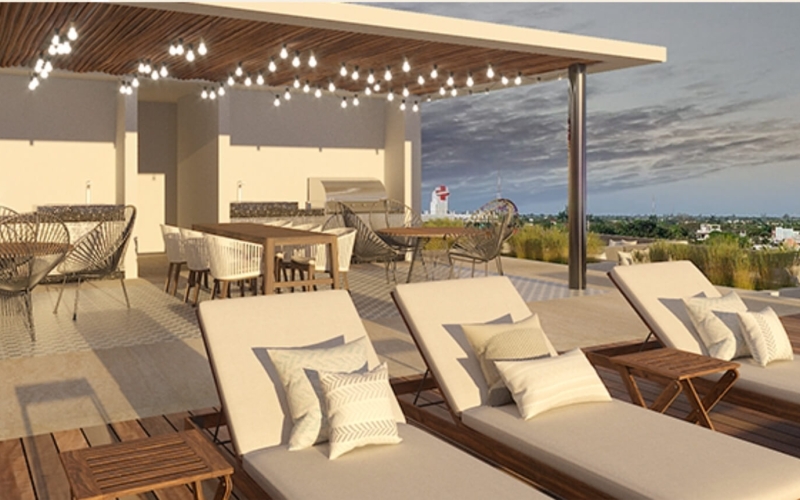 Apartment near the boardwalk, terrace with ocean view pool for sale Cozumel.