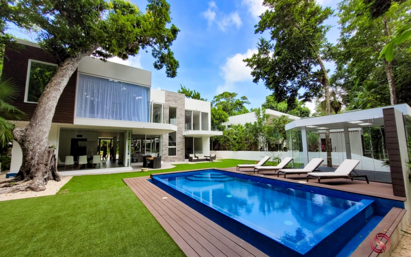 House with pool on golf course with beach club for sale Tulum Country Club.