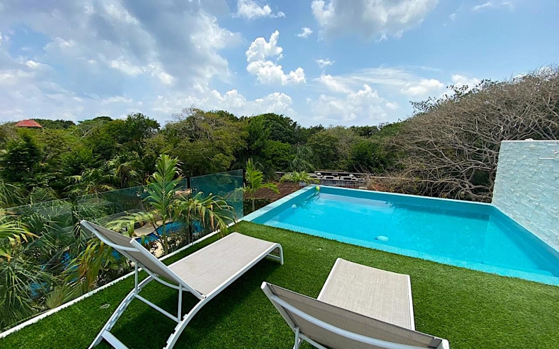 4-bedroom house, private pool, ocean access, 2 independent studios for sale in Playacar Phase 2.