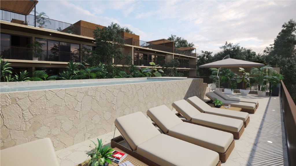 Condo for sale in Aldea Zama yoga area, terraces with lounge chairs,beach club access