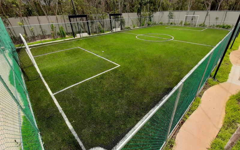 Lot in a private residential community with a clubhouse, sports courts, swimming pool, and dog areas for sale in Playa del Carmen.