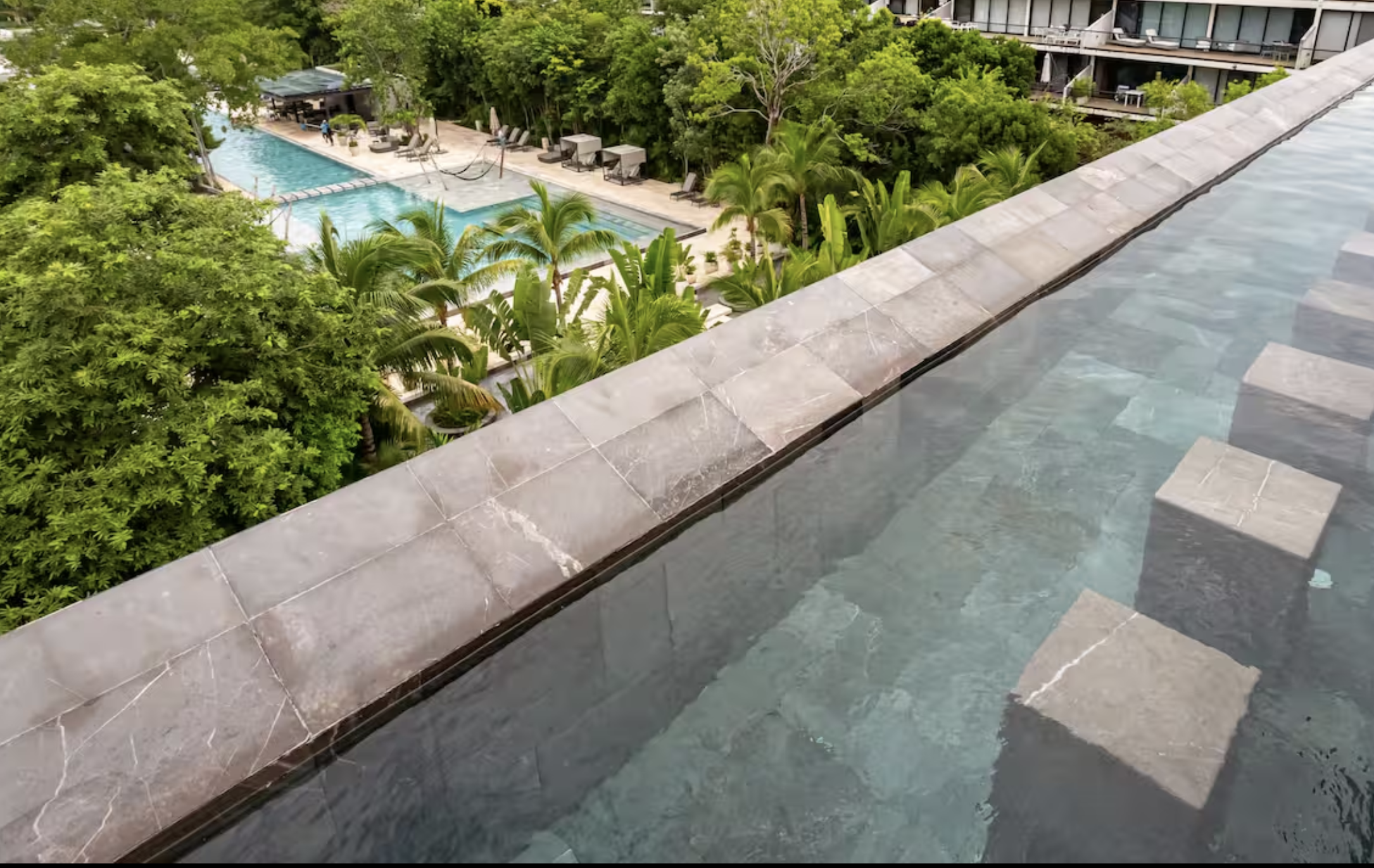 Condo steps from Fifth Avenue and the beach, rooftop, for sale Playa del Carmen.