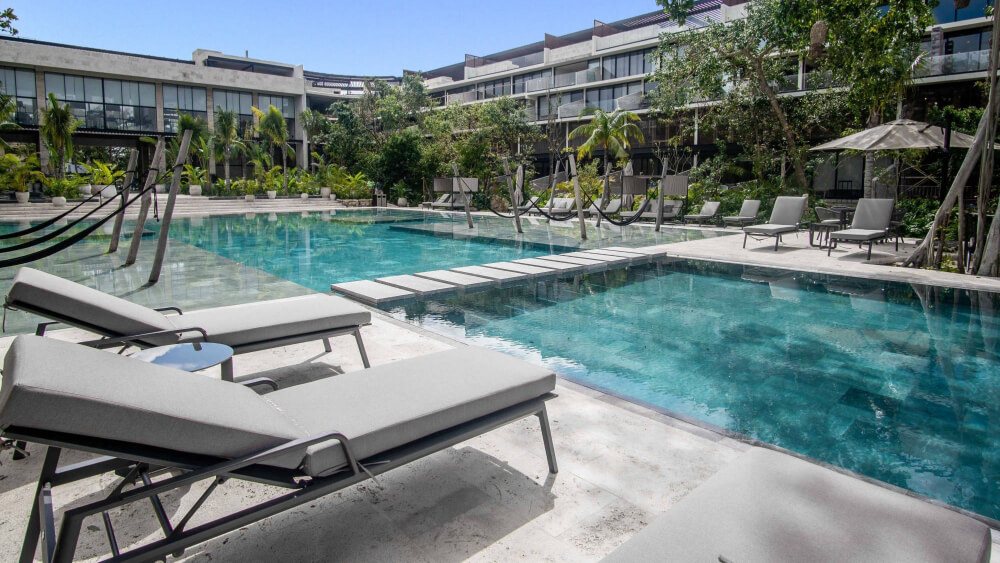 Condo steps from Fifth Avenue and the beach, rooftop, for sale Playa del Carmen.