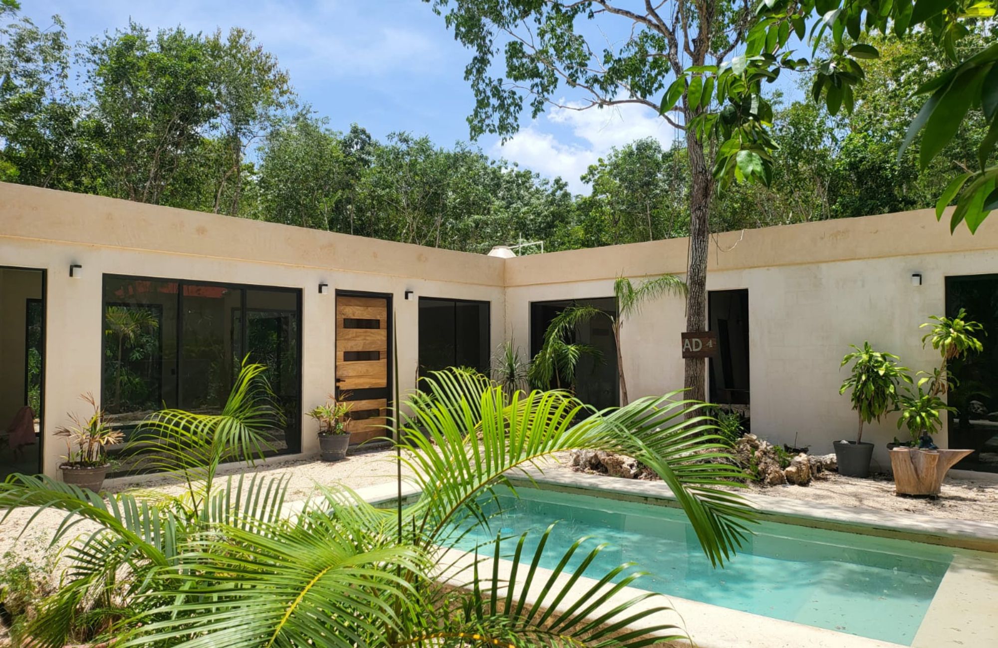 Luxury house with private pool, Green views, clubhouse with sports fields, in gated community Aqua, Cancun, for sale.