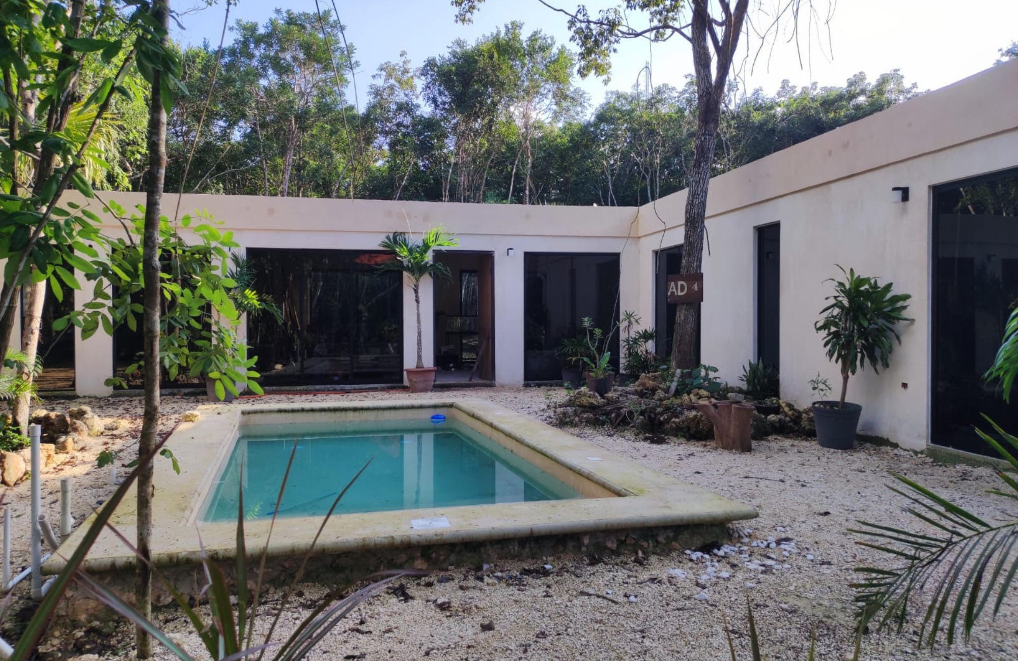 Luxury house with private pool, Green views, clubhouse with sports fields, in gated community Aqua, Cancun, for sale.