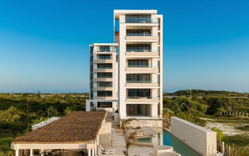 Departamento a pasos de la playa con alberca, coworking y terrazas, en venta