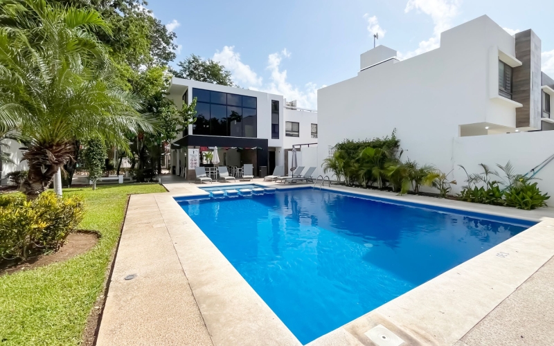 Semi-furnished two-story house in gated community with garden and pool, for sale