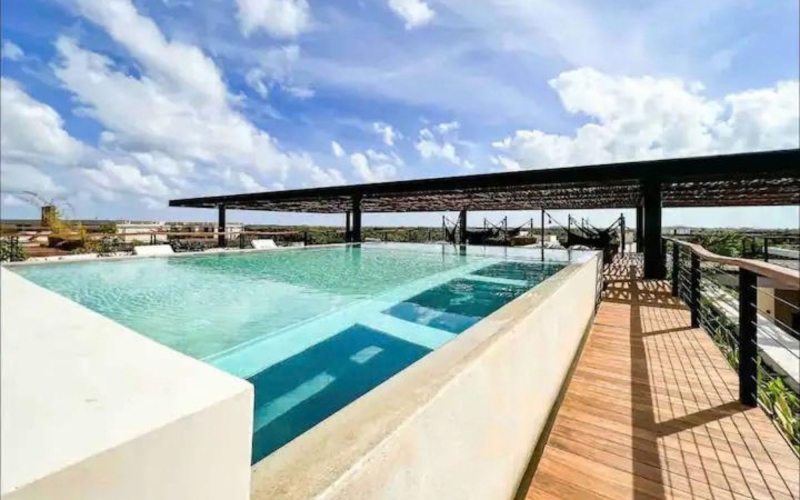 Designer condo with lock-off system and private pool, for sale