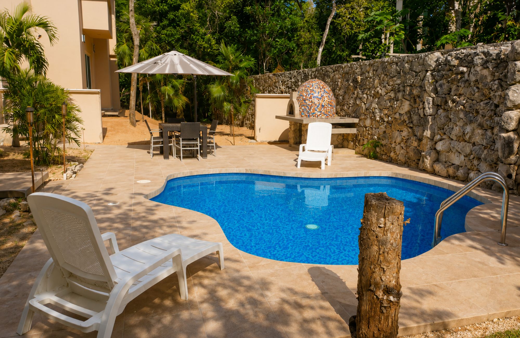 Single-family lot for sale with pools, cenote, movie theater, and green areas