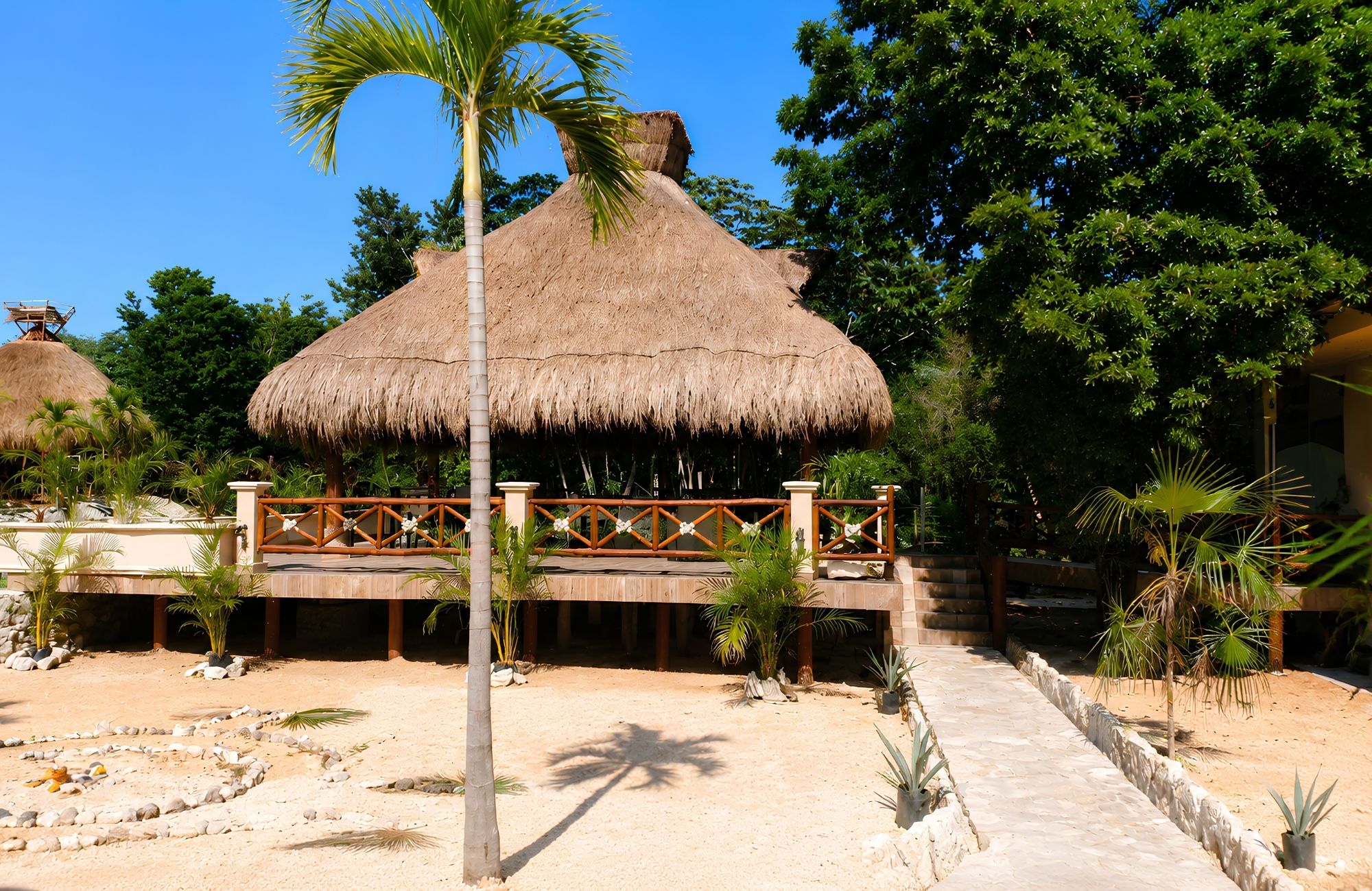 Single-family lot for sale with pools, cenote, movie theater, and green areas