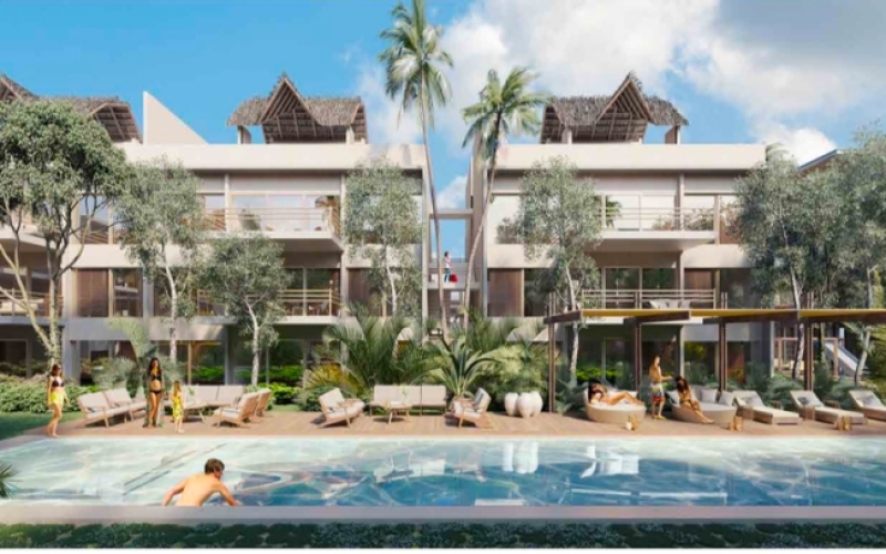 Condo for sale in Aldea Zama yoga area, terraces with lounge chairs,beach club access