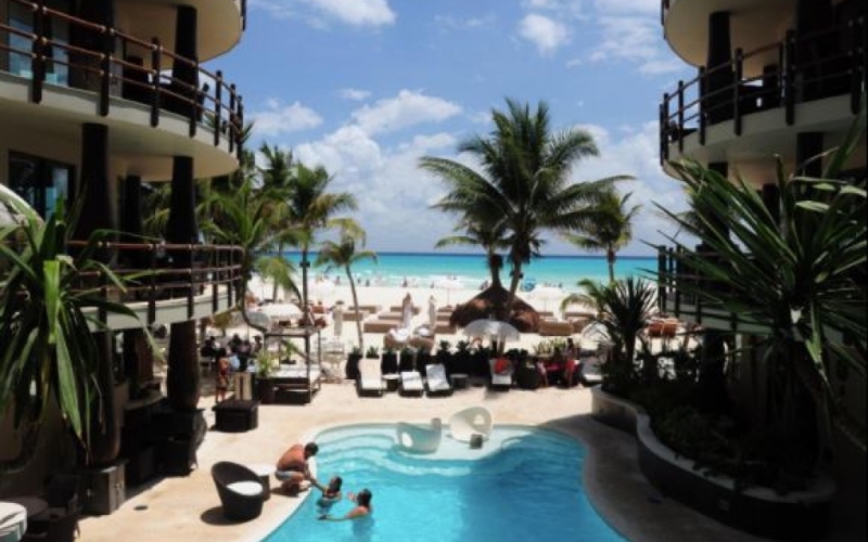 Beachfront condo, ground floor. spa, beach club, gym, for sale in Playa del Carmen.