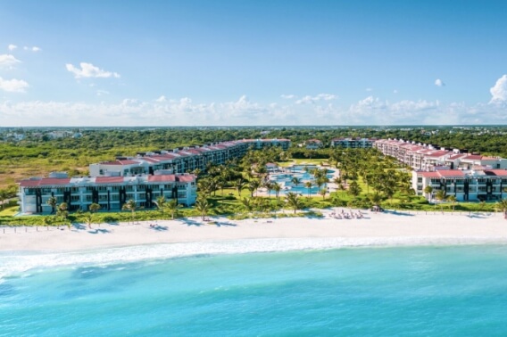 Beachfront condo, ocean view terrace with private jacuzzi, spa, beach club, gym, golf course, + amenities in Corasol, for sale.