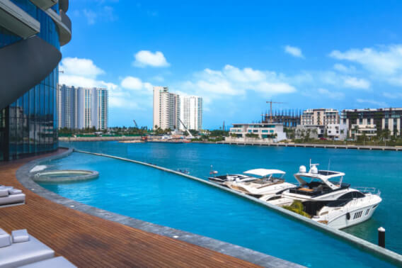 3-bedroom condo with ocean and marina views, with amenities: infinity pool, spa, gym, lounge area, meeting room, lobby