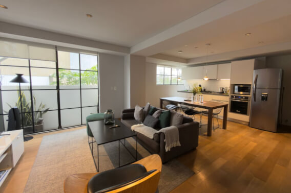 Furnished condo with laundry area, balcony, and amenities, for sale