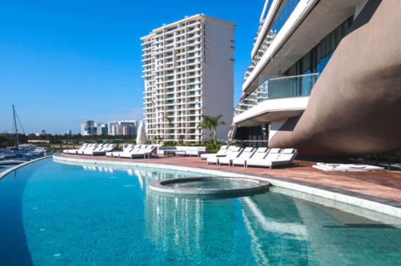 Ocean view condo with amenities: infinity pool, spa, gym, lounge area, event room, lobby, located in Puerto Cancun