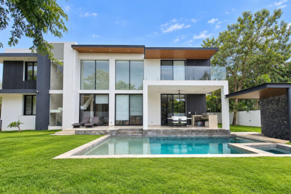Exclusive double-height house in El Cortijo with private pool and clubhouse, for sale
