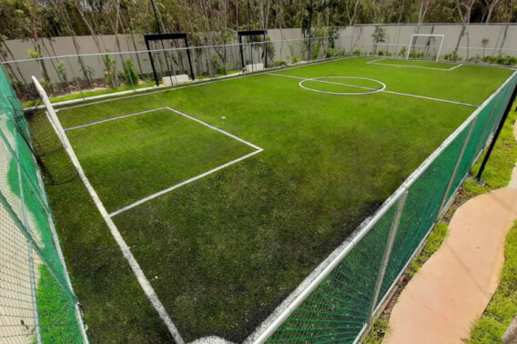 Lot in a private residential community with a clubhouse, sports courts, swimming pool, and dog areas for sale in Playa del Carmen.