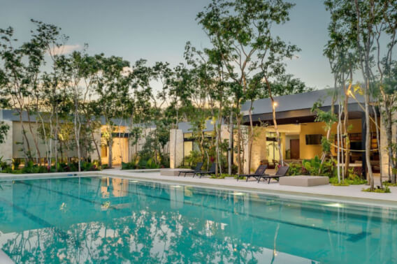 Land in a private residential community with a clubhouse, sports courts, swimming pool, and dog areas for sale in Playa del Carmen.