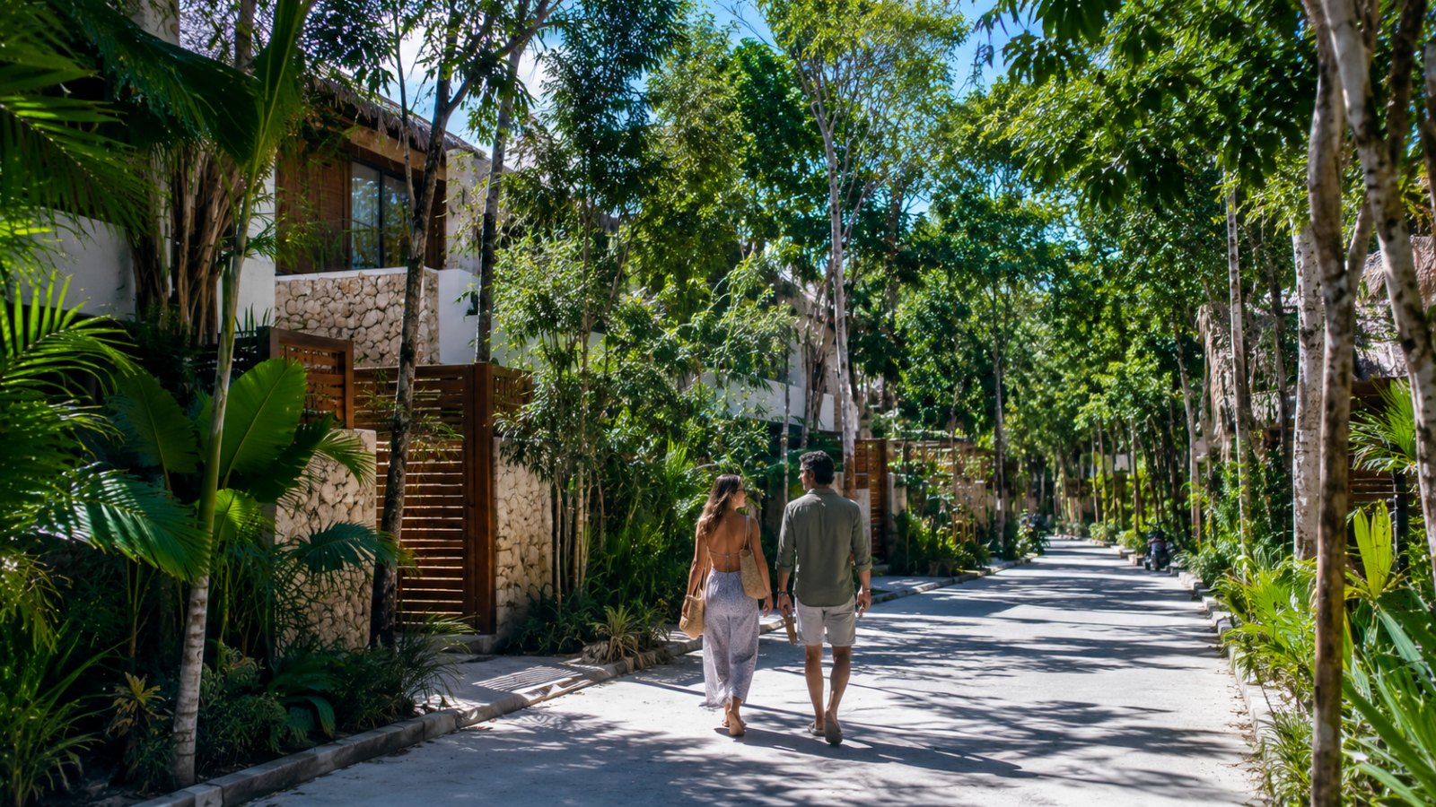 Quiet Tulum residential street with boutique villas and tropical landscaping