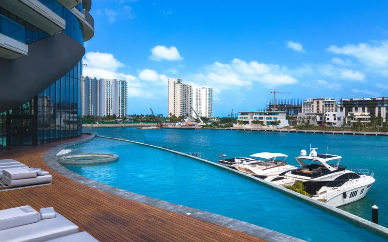 3-bedroom condo with ocean and marina views, with amenities: infinity pool, spa, gym, lounge area, meeting room, lobby