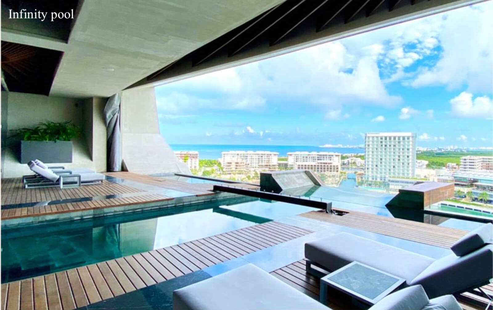 Ocean view condo with amenities: infinity pool, spa, gym, lounge area, event room, lobby, located in Puerto Cancun