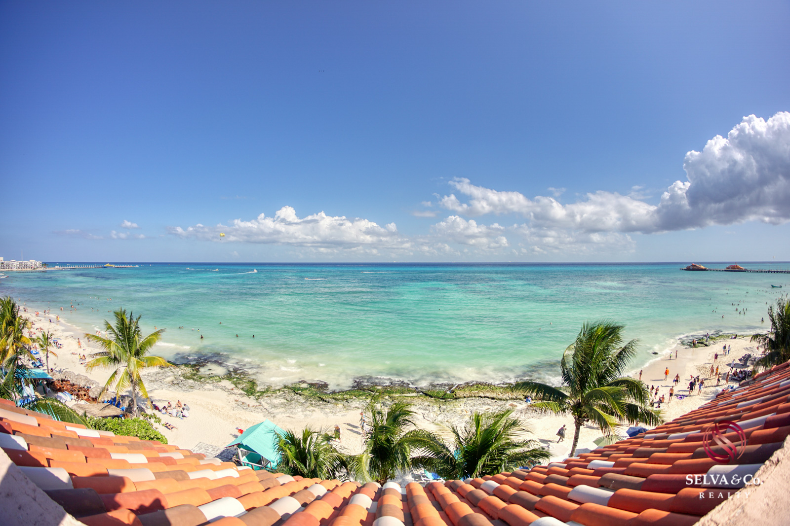 Property with 2 apartments steps from the beach in Playacar phase 1 for sale.