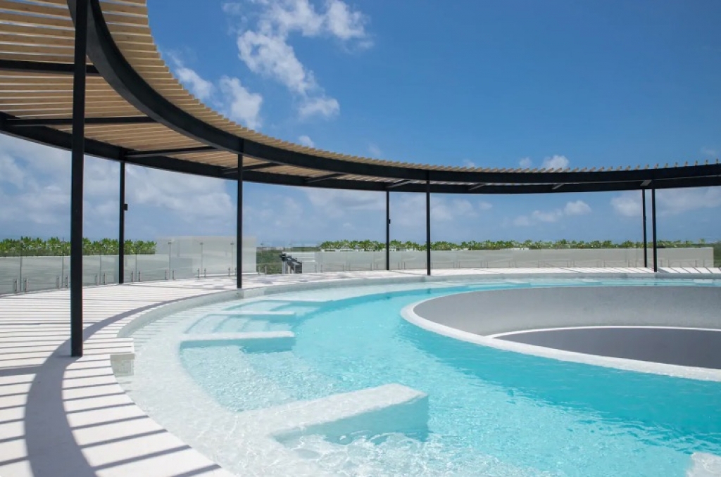 Penthouse steps from the ocean with beach club in Akumal Tulum