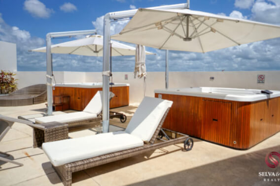 Condo with 3 pools, roof top terrace with 6 Jacuzzis, barbecue area, terrace with bar, in Lagunas de Ciudad Mayakoba for sale.